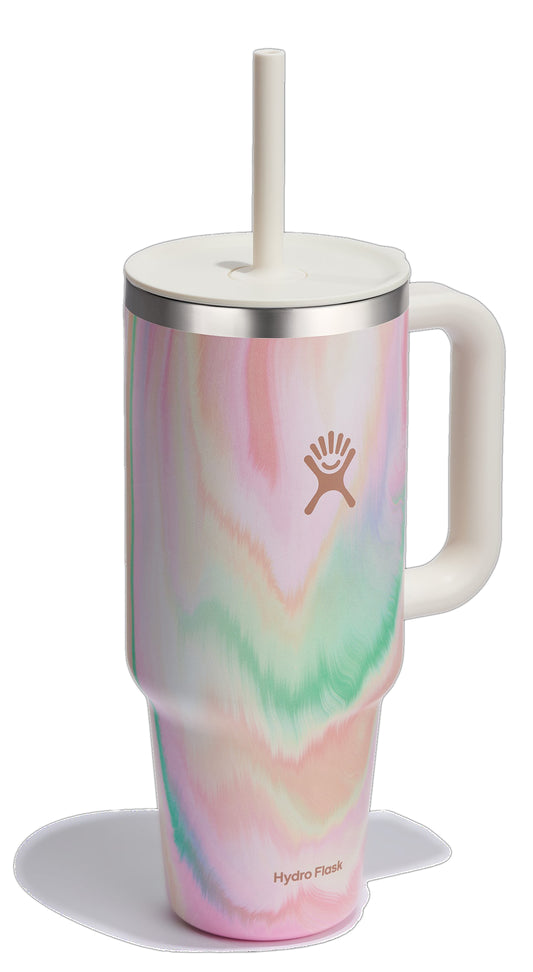 Tall, multicolored stainless steel mug with a white handle, white lid, and straw.