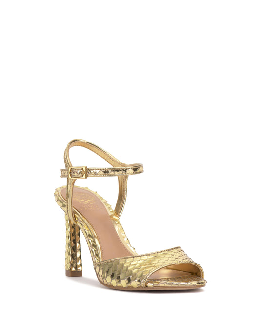 Gold high heel sandal with ankle strap and textured pattern.
