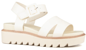 White platform sandal with thick straps and buckle closure.