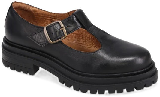 A black leather T-strap mary jane shoe with a chunky, lugged platform sole and an antique-brass buckle closure.