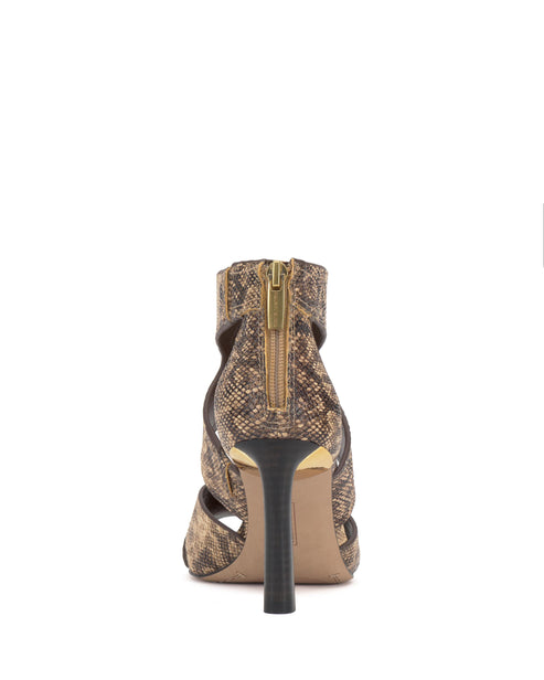 Close-up of a snakeskin high heel with strappy detailing and a back zipper.