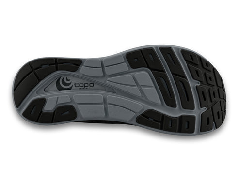 Bottom view of a shoe with a gray and black sole and a logo.