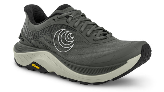 Charcoal colored shoe with white swirly logo on side, and Vibram label on the sole.