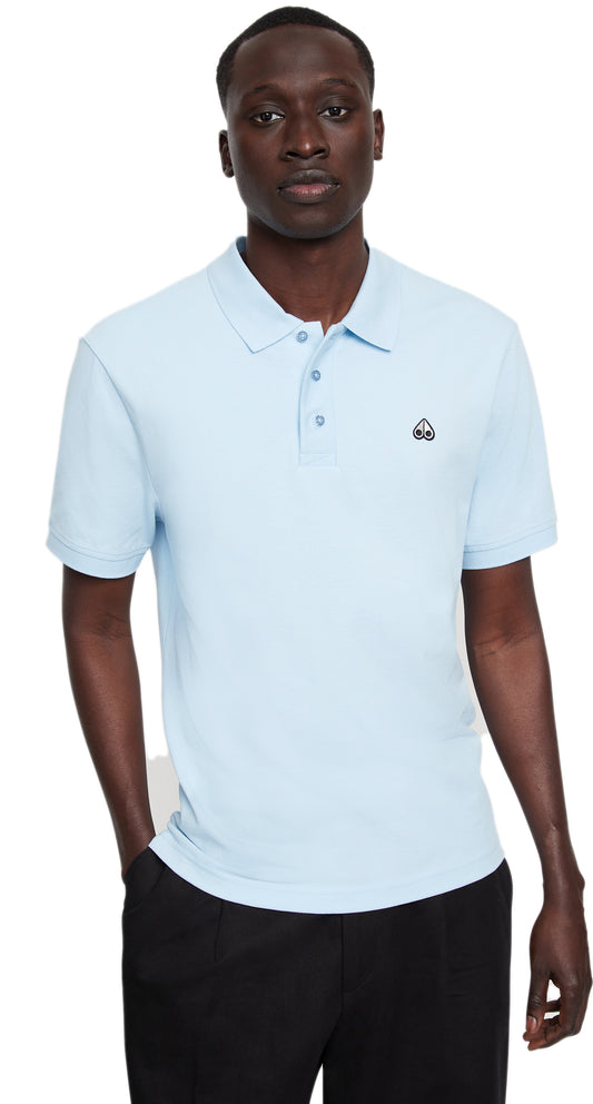 Man in light blue polo shirt with short sleeves.