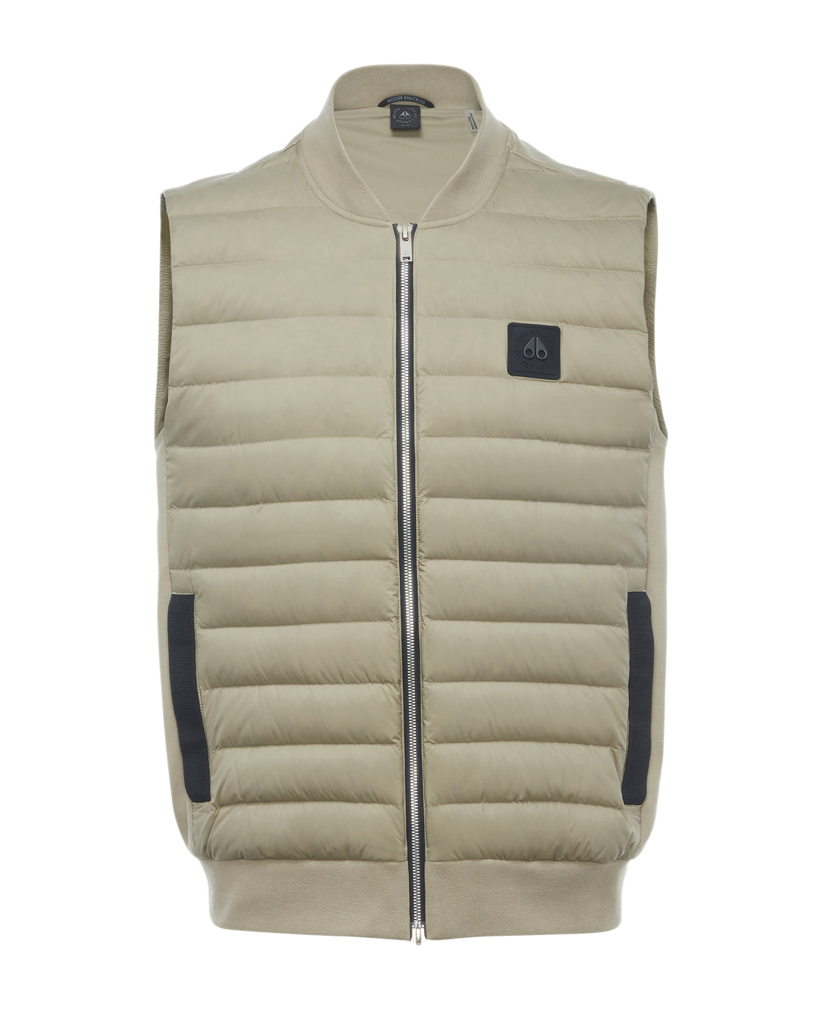 Tan puffer vest with a full zipper, black side pockets, and a black patch on the upper left chest.