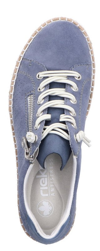 A blue sneaker with white laces and a white interior.