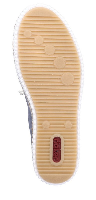 shoe sole with ridged surface and circular pads