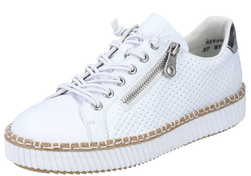 White sneaker with side zipper and lace-up closure on a textured sole.