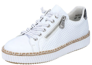 White sneaker with side zipper and lace-up closure on a textured sole.