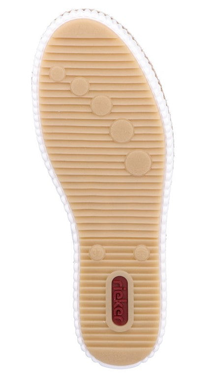 Beige shoe sole with horizontal grooves, circular indentations, and red logo.