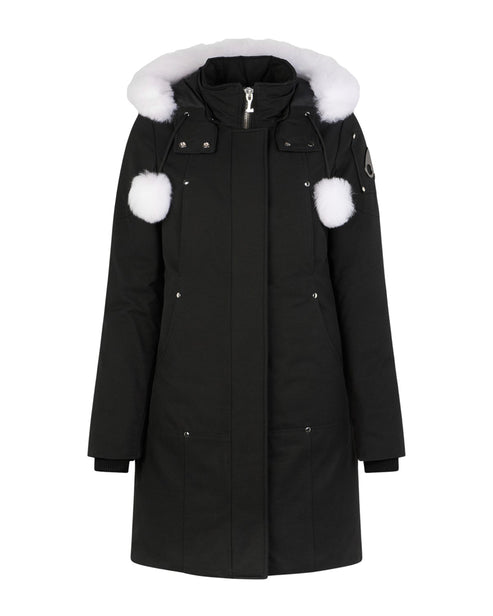 Black parka coat with white fur-lined hood and white pom poms on the sleeves.