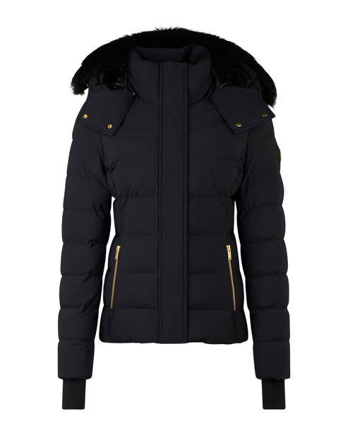 Black puffer jacket with a fur-trimmed hood and gold zippers.