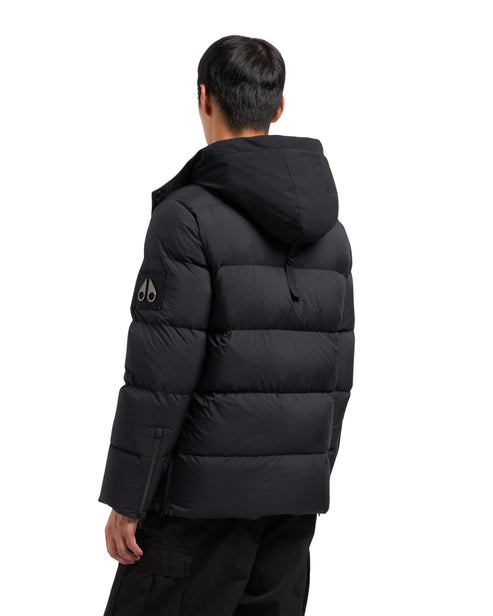 Black puffer jacket with hood and logo on upper arm, shown from the back.