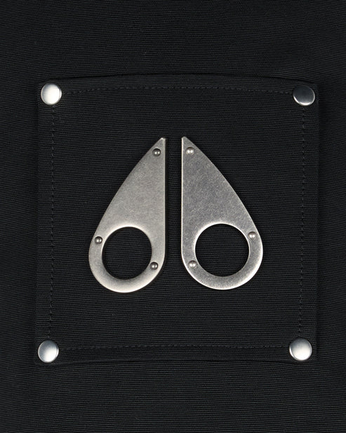 Black square patch with two silver, teardrop shaped metal accents and four metal rivets.