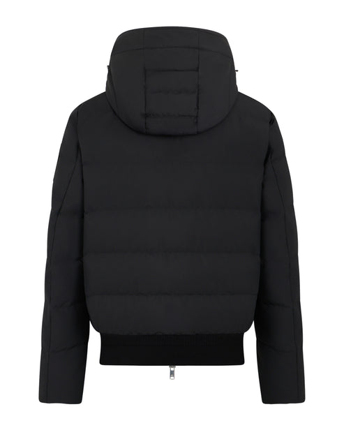 Back view of a hooded, black, puffer jacket with ribbed hem.