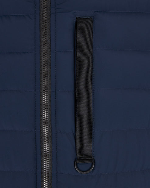 Navy blue puffer vest section with zipper and black strip with metal ring.