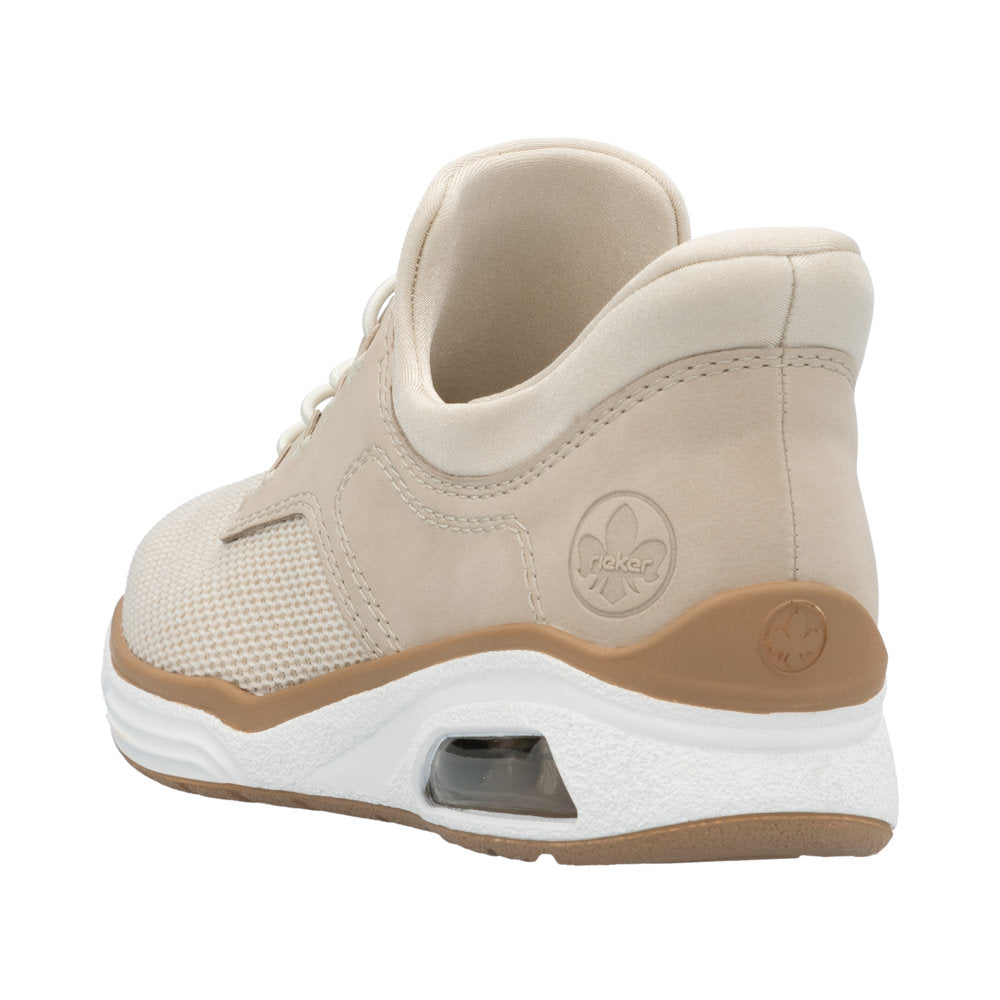 Beige athletic shoe with mesh, leather, brown trim, white sole, and air pocket visible.
