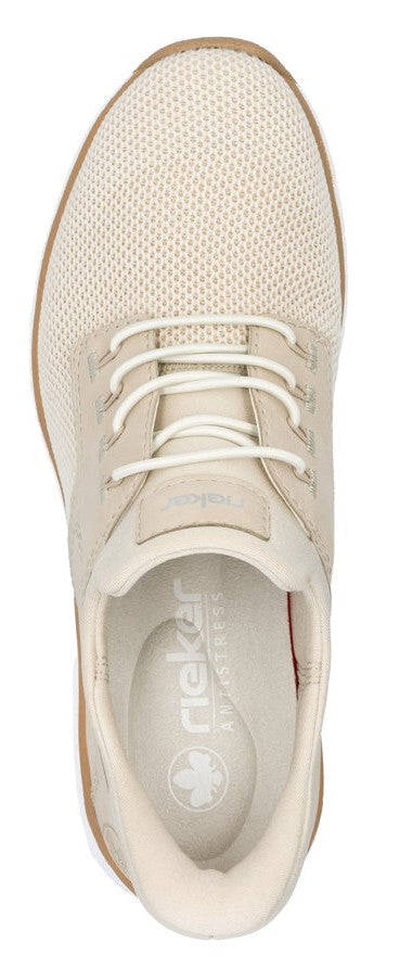 Beige sneaker with white laces and visible insole featuring a clover logo and text 'rieker ANTISTRESS'.