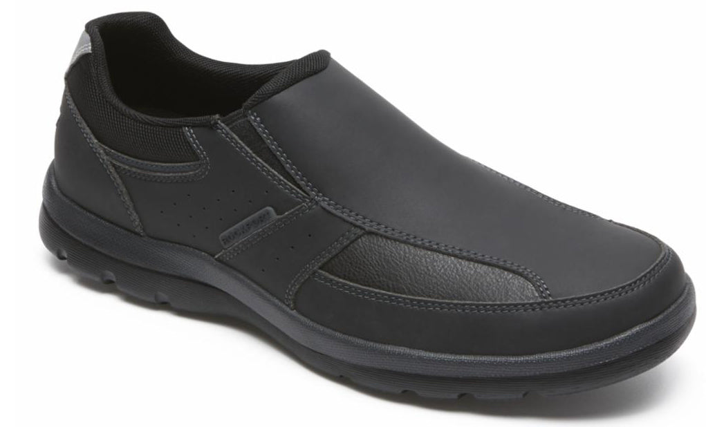 Black slip-on dress shoe with rounded toe and textured panels.