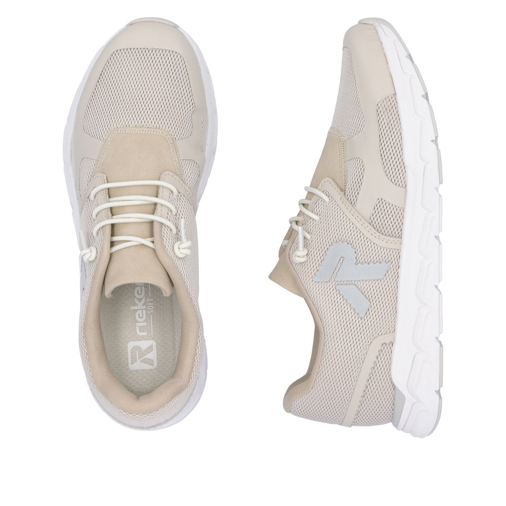 Two beige sneakers with white soles and laces; one is seen from above while the other is viewed from the side. One shoe has a large R visible.