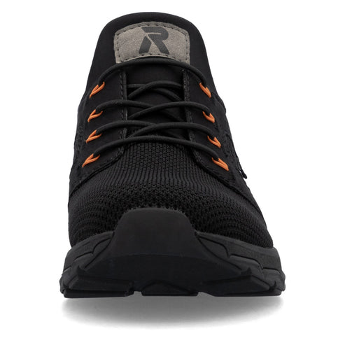 Black sneaker with orange accents and a grey patch with a logo.