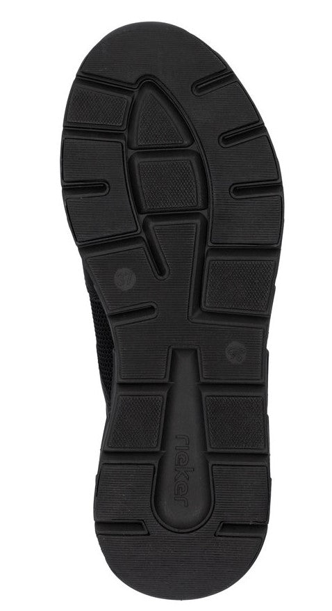 Black shoe sole with textured tread pattern and the word 'Rieker' visible.