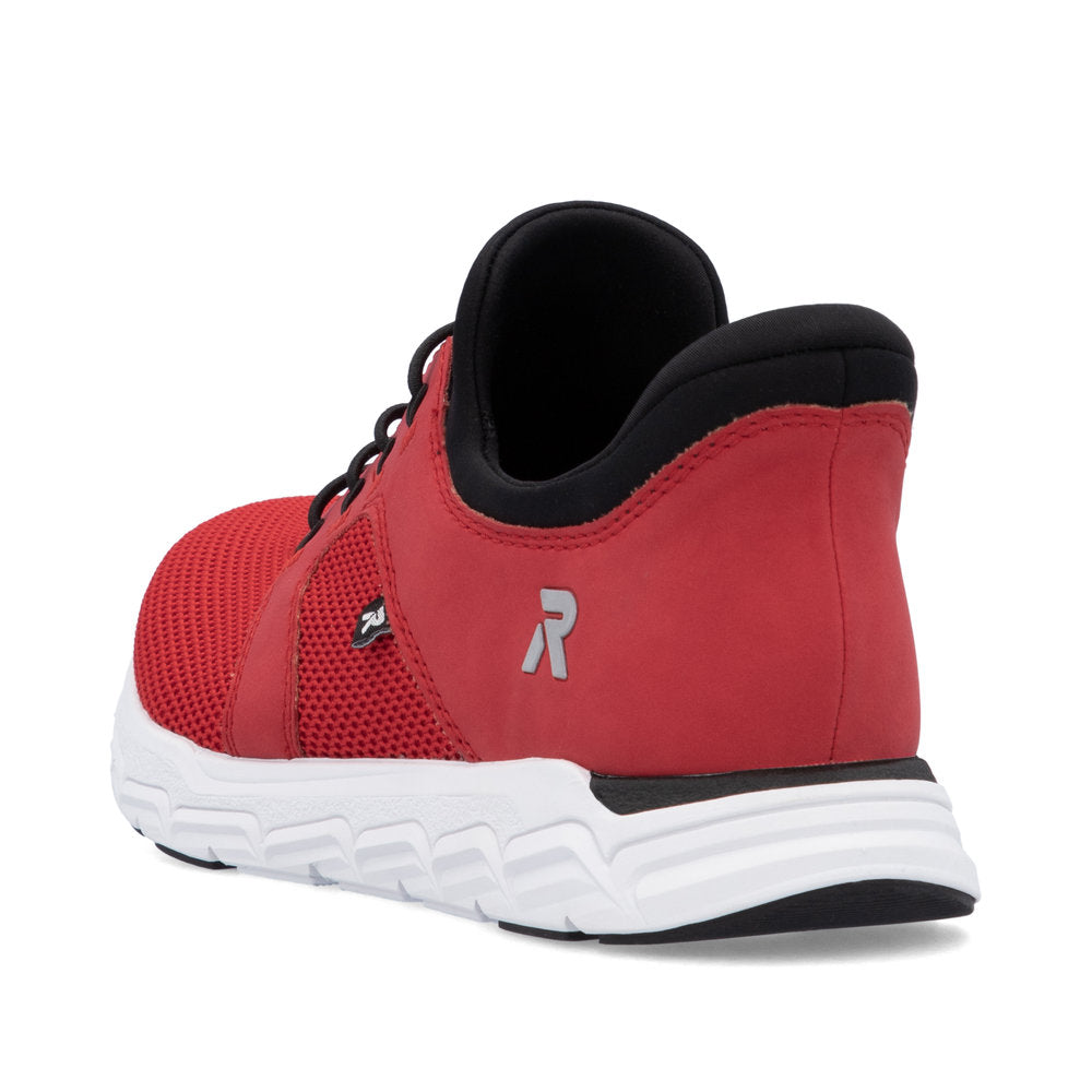 Red athletic shoe with black lining and white sole showing a logo with an R