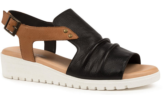 Black and brown wedge sandal with buckle closure.