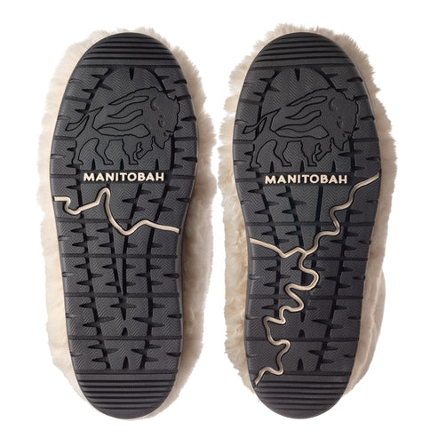 Pair of slippers with dark gray soles featuring a bison design and the word MANITOBAH.