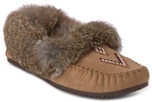A tan suede moccasin-style slipper with a thick brown rabbit fur collar, featuring a geometric beadwork design on the vamp and a whip-stitched edge.
