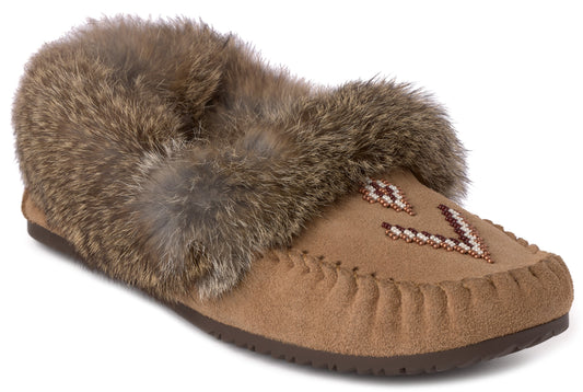 A tan suede moccasin-style slipper with a thick brown rabbit fur collar, featuring a geometric beadwork design on the vamp and a whip-stitched edge.