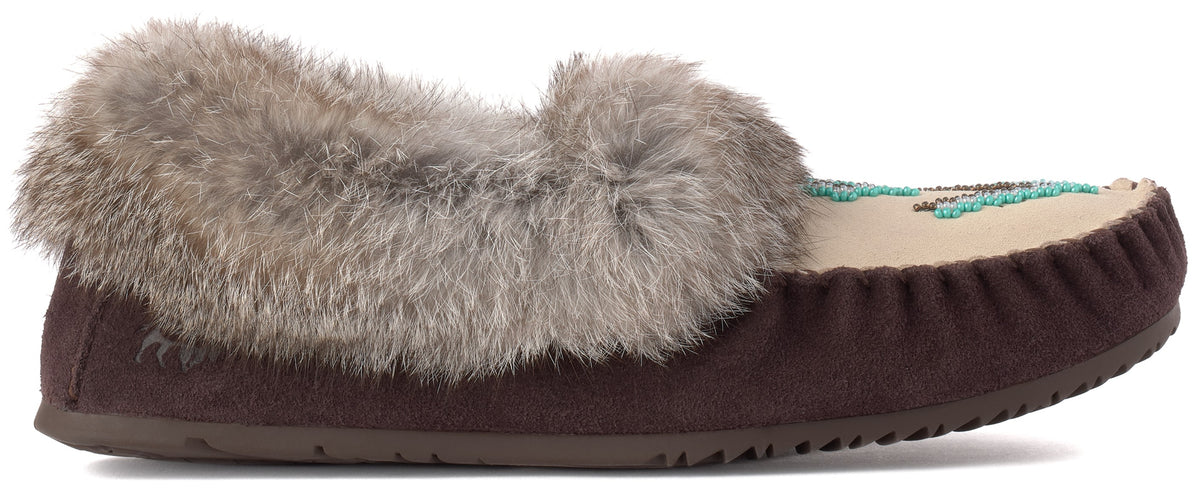 A brown suede slipper with a plush grey faux-fur trim around the opening and decorative teal and brown beadwork on the top of the toe.