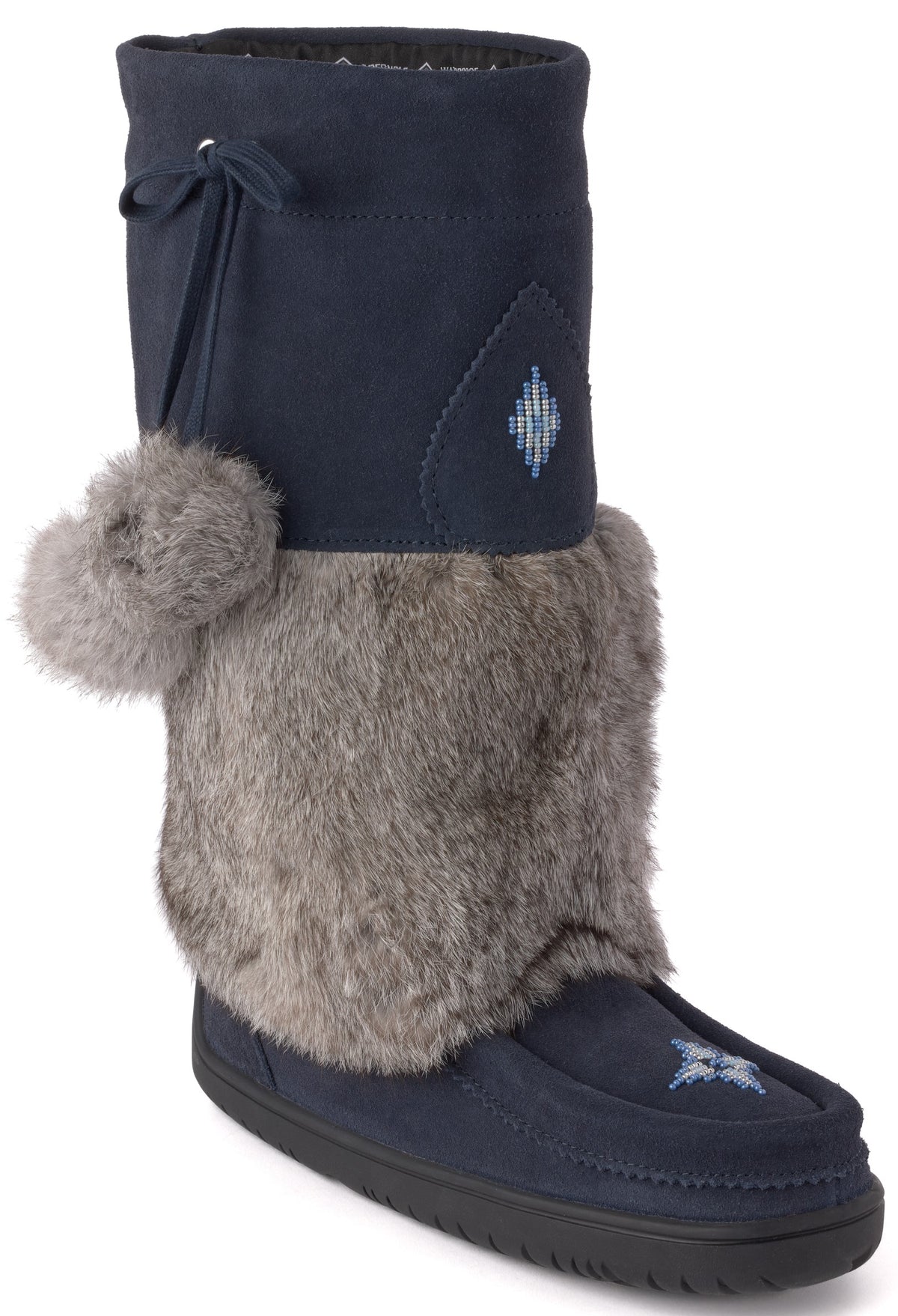 A dark navy blue suede calf-height winter boot with a thick gray faux fur cuff, a decorative pom-pom on the side, a tie closure at the top, and embroidered geometric snowflake-like details on the upper and toe.