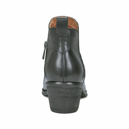 Black leather ankle boot with side zipper and block heel, back view.