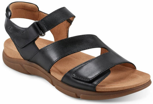 Black leather sandals with velcro straps and brown soles.