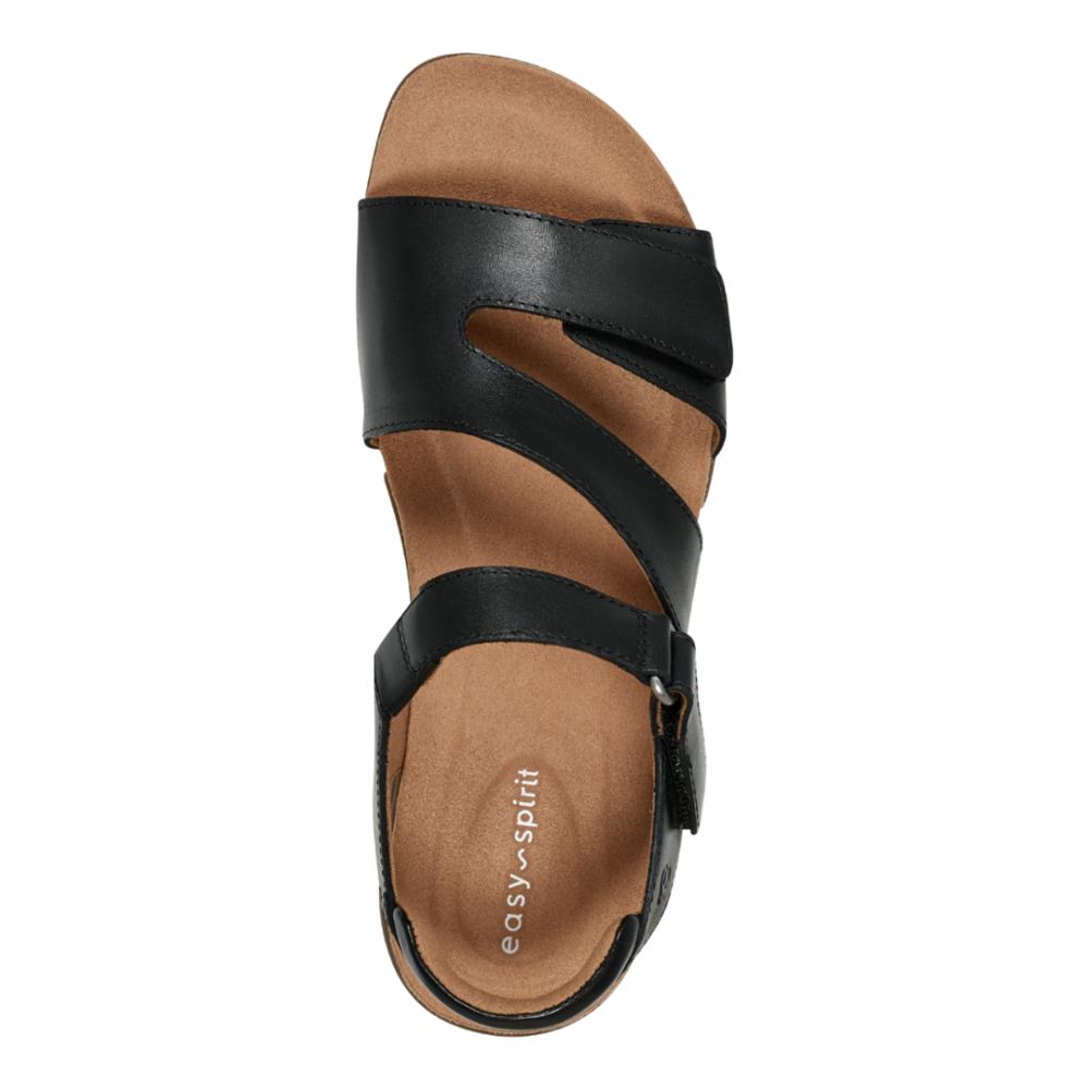 Black sandal with adjustable straps and a low heel.