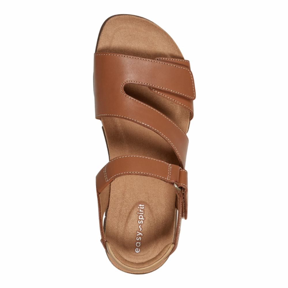 Top-down view of a light brown sandal with hook and loop adjustable straps and "easy spirit" logo on footbed.