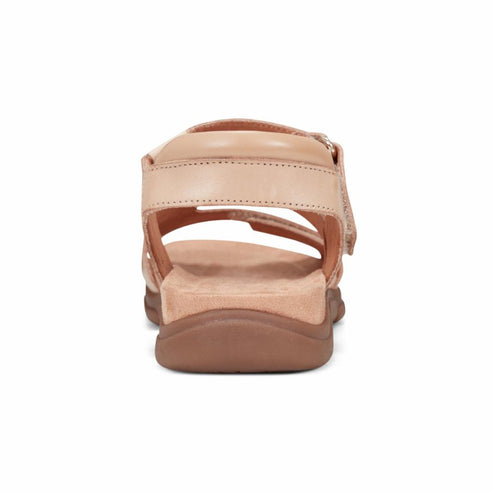 Tan sandal with velcro straps.