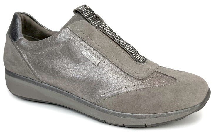 A gray slip-on shoe with suede toe and decorative, silvery band.
