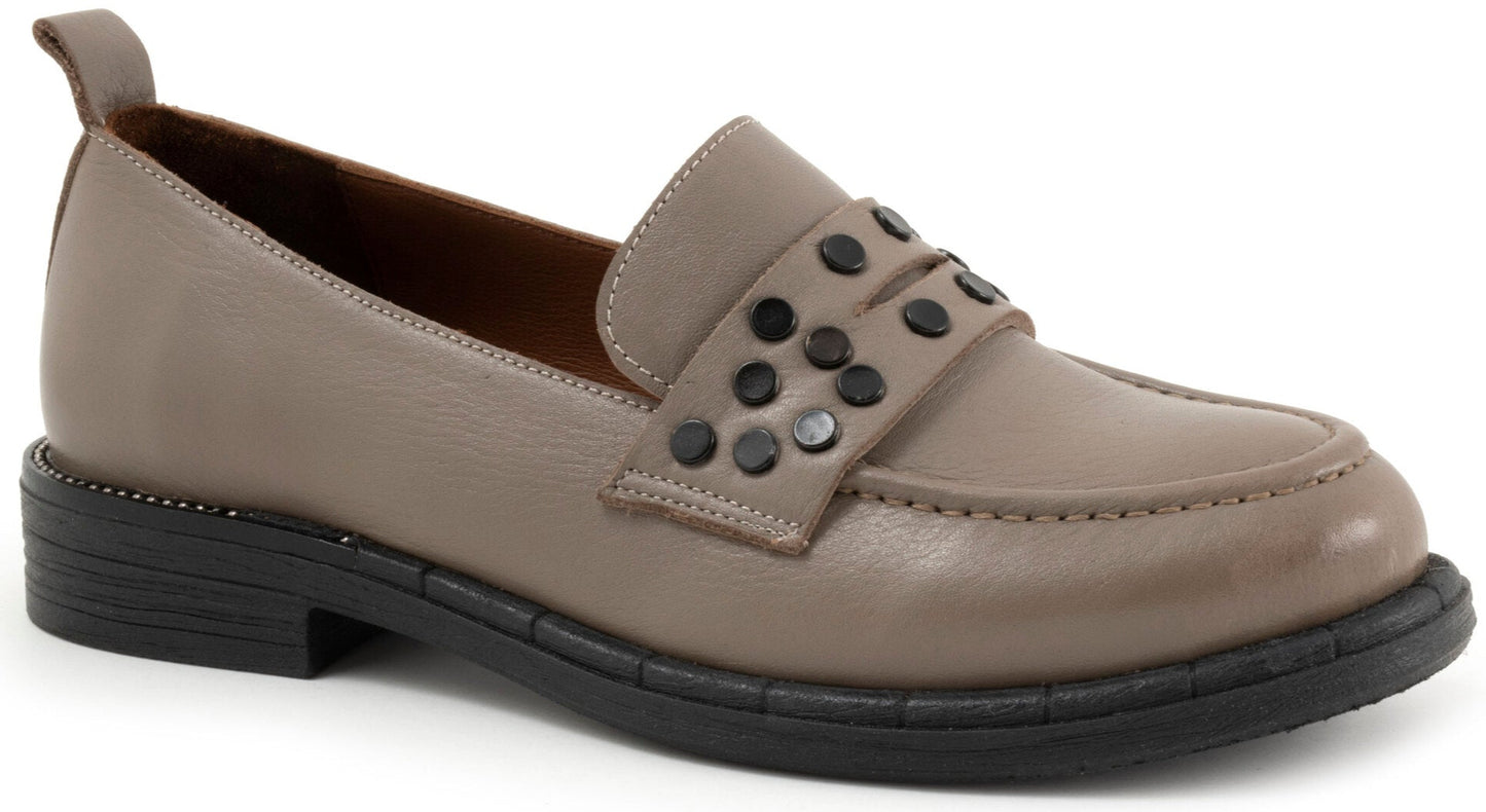 Taupe loafer with a wide band decorated with dark studs.