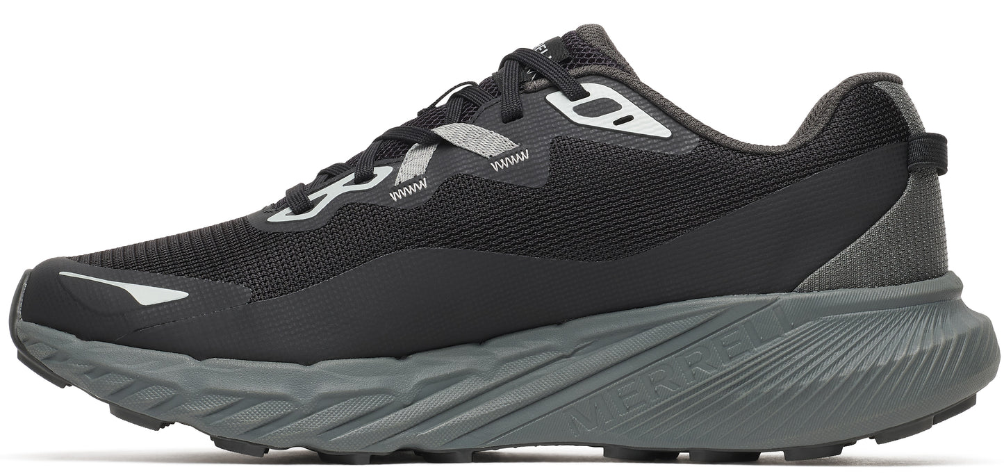 A black running shoe with gray sole.