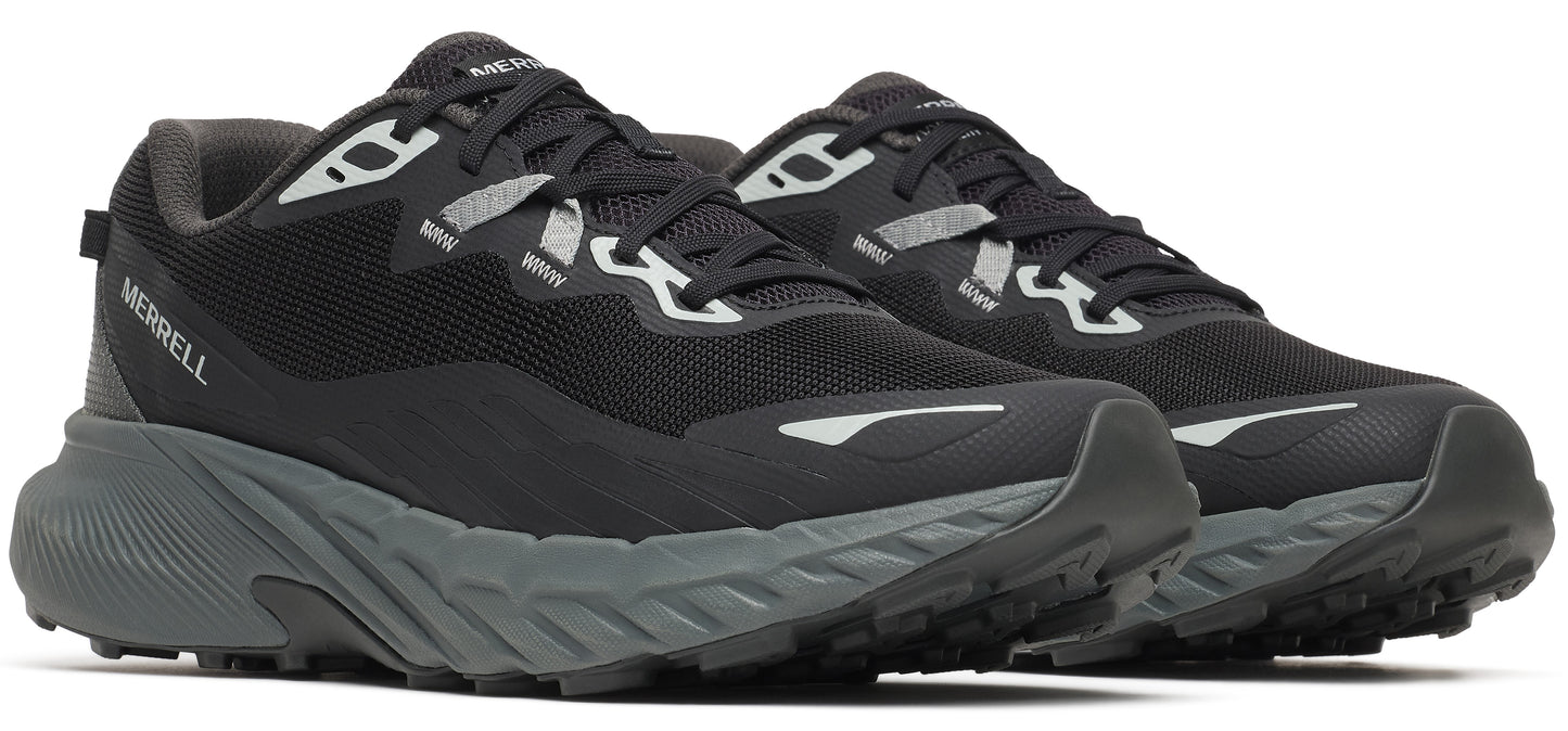 A pair of black trail running shoes with a gray sole.