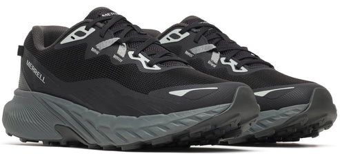A pair of black trail running shoes with a gray sole.