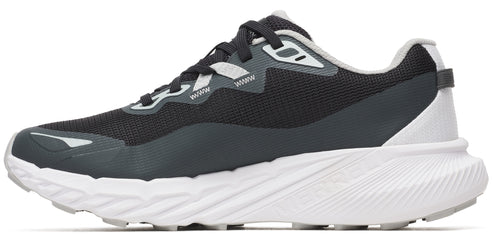 Side profile of a running shoe that is dark colored with white soles.