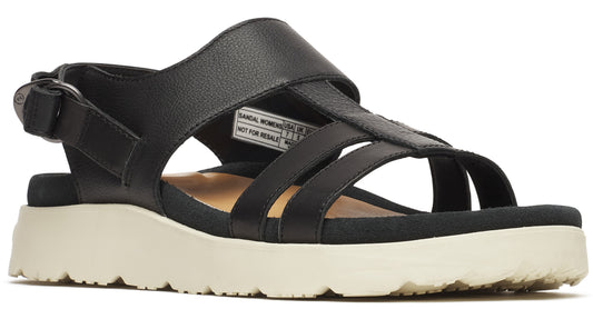 Black women's sandal with a thick white sole and multiple straps. One strap goes around the ankle with a buckle closure.