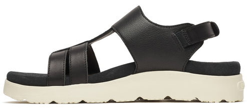 A black sandal with a thick white sole and an ankle strap.