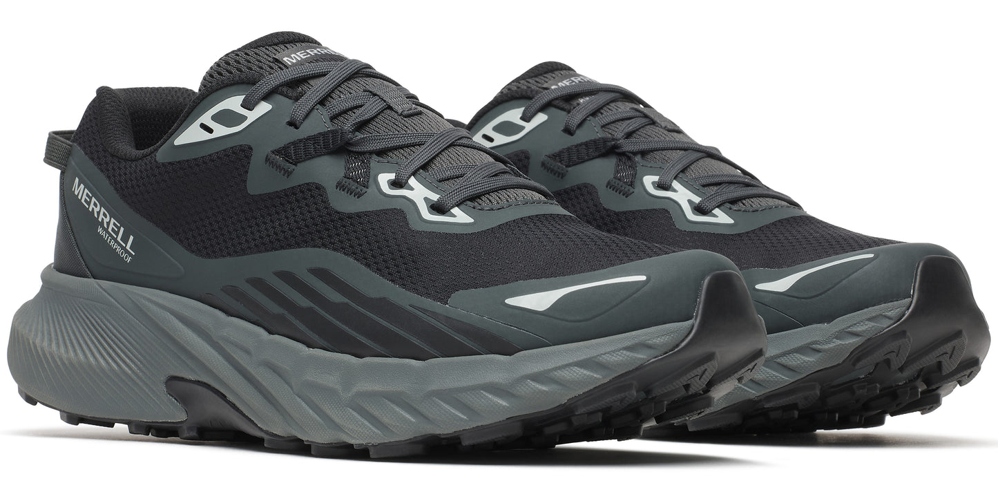 A pair of black athletic shoes with gray soles.