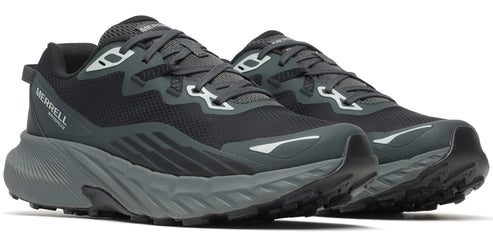 A pair of black athletic shoes with gray soles.