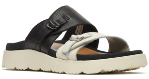 Black and white sandal with two buckled straps and a thick, textured sole.