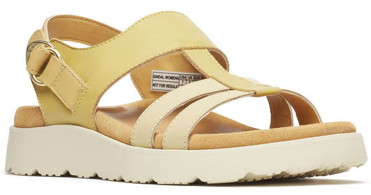 Yellow and cream T-strap sandal with a thick sole.